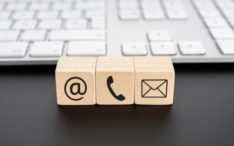 contact-us-icons-on-wooden-blocks-and-computer-key